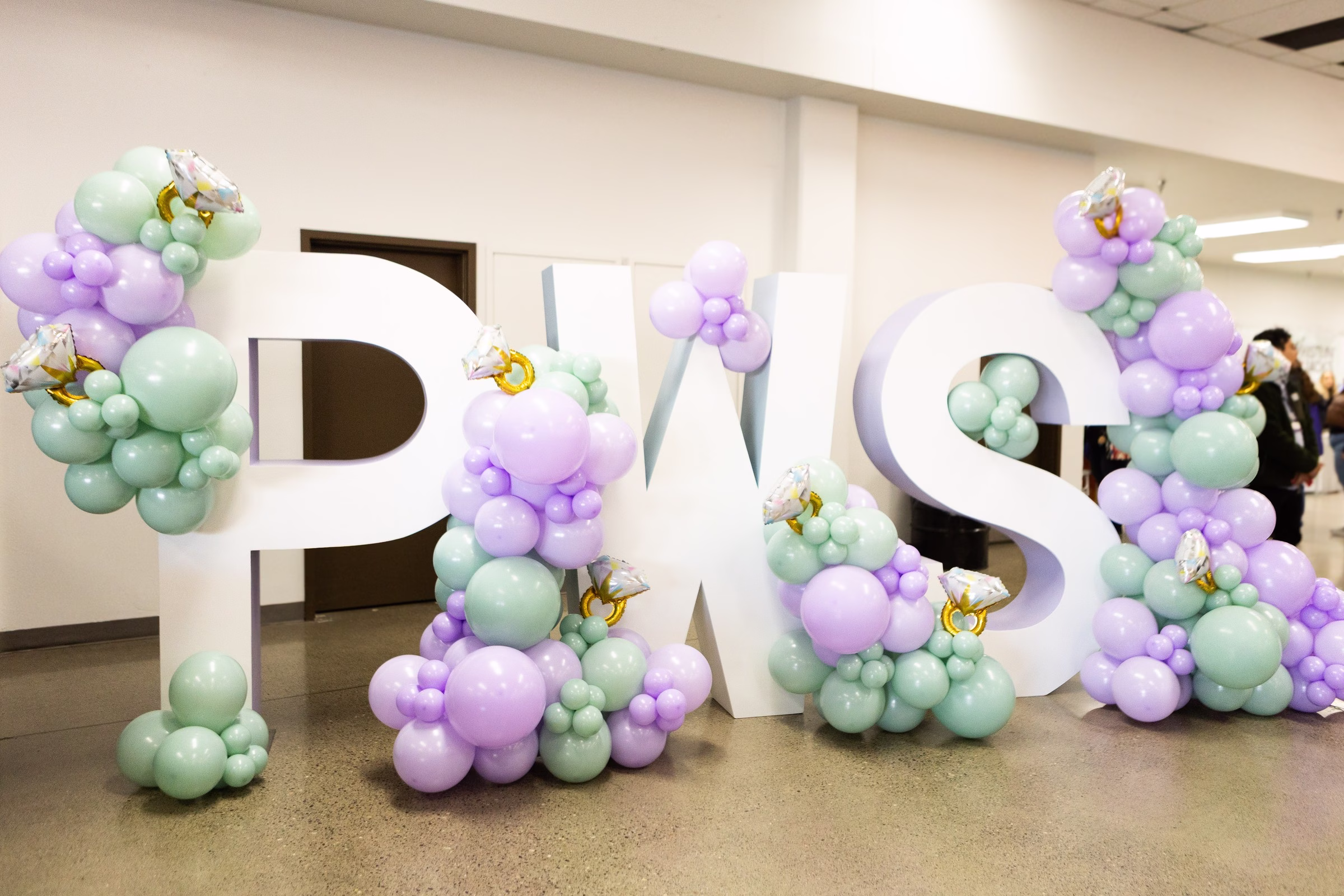 pws balloon letters puyallup wedding show display - Exhibiting Information Large white PWS letter displays decorated with mint and lavender balloon garlands and diamond ring balloons at the Puyallup Wedding Show in Puyallup Washington